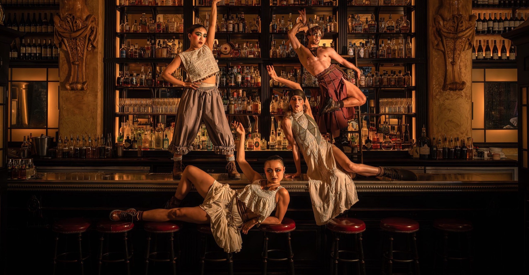 Cabaret's Kit Kat Club cast on the bar at Balthazar London